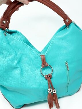 Spacious Teal & Tan Shoulder Bag with Multiple Compartments & a Charm